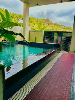 Private swimming pool at Splash Heaven Villa with Nandi Hills in the background